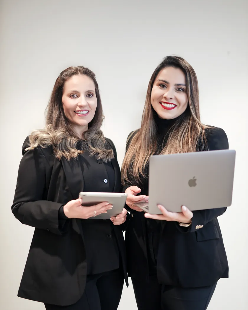 The founders of ThriveUp Career preparing client career materials