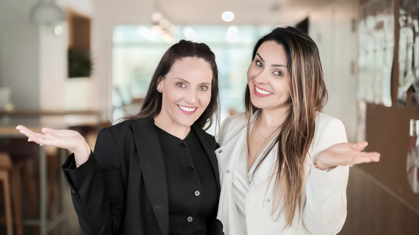 The founders of ThriveUp Career welcoming clients in their office